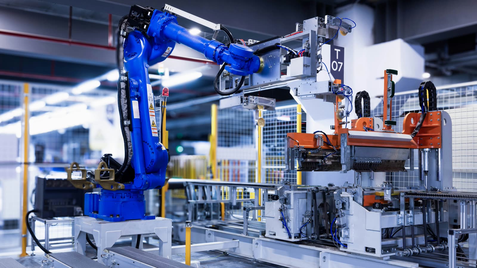 Industrial robot arm running an automated production cell