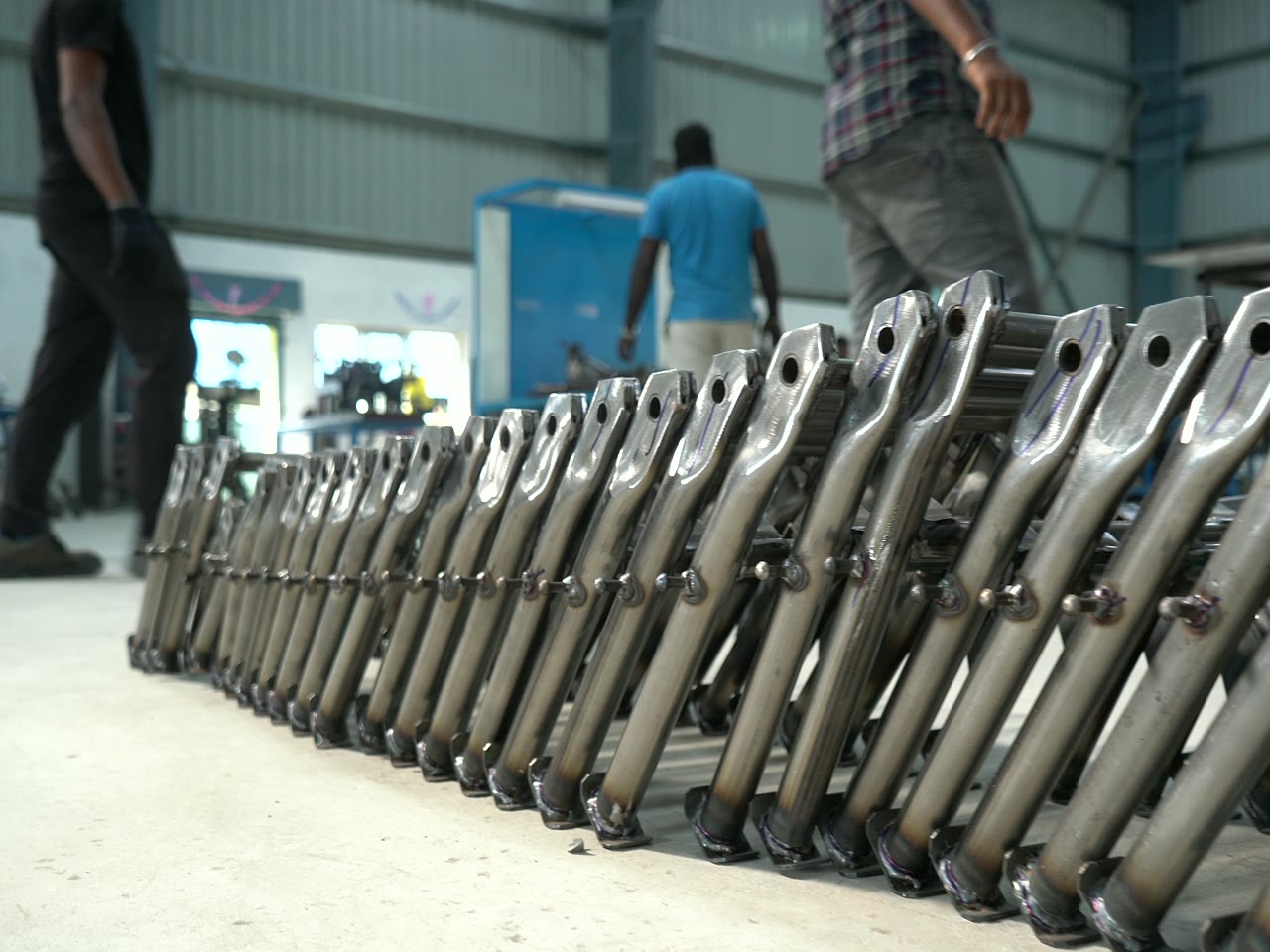 Rows of machined metal frames on the shop floor