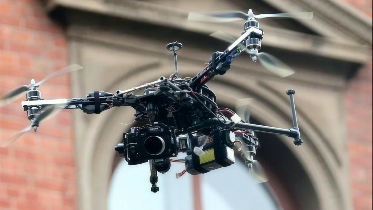 Multirotor camera drone in flight